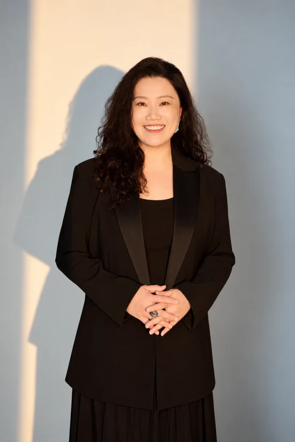 Ang Mei Foong in a black suit