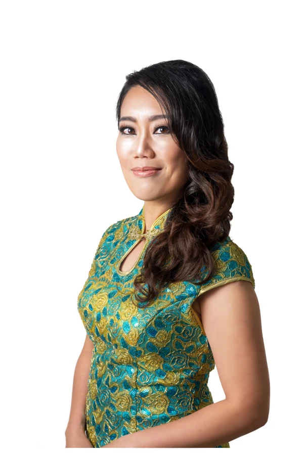 Ang Mei Foong in a turquoise and gold qipao